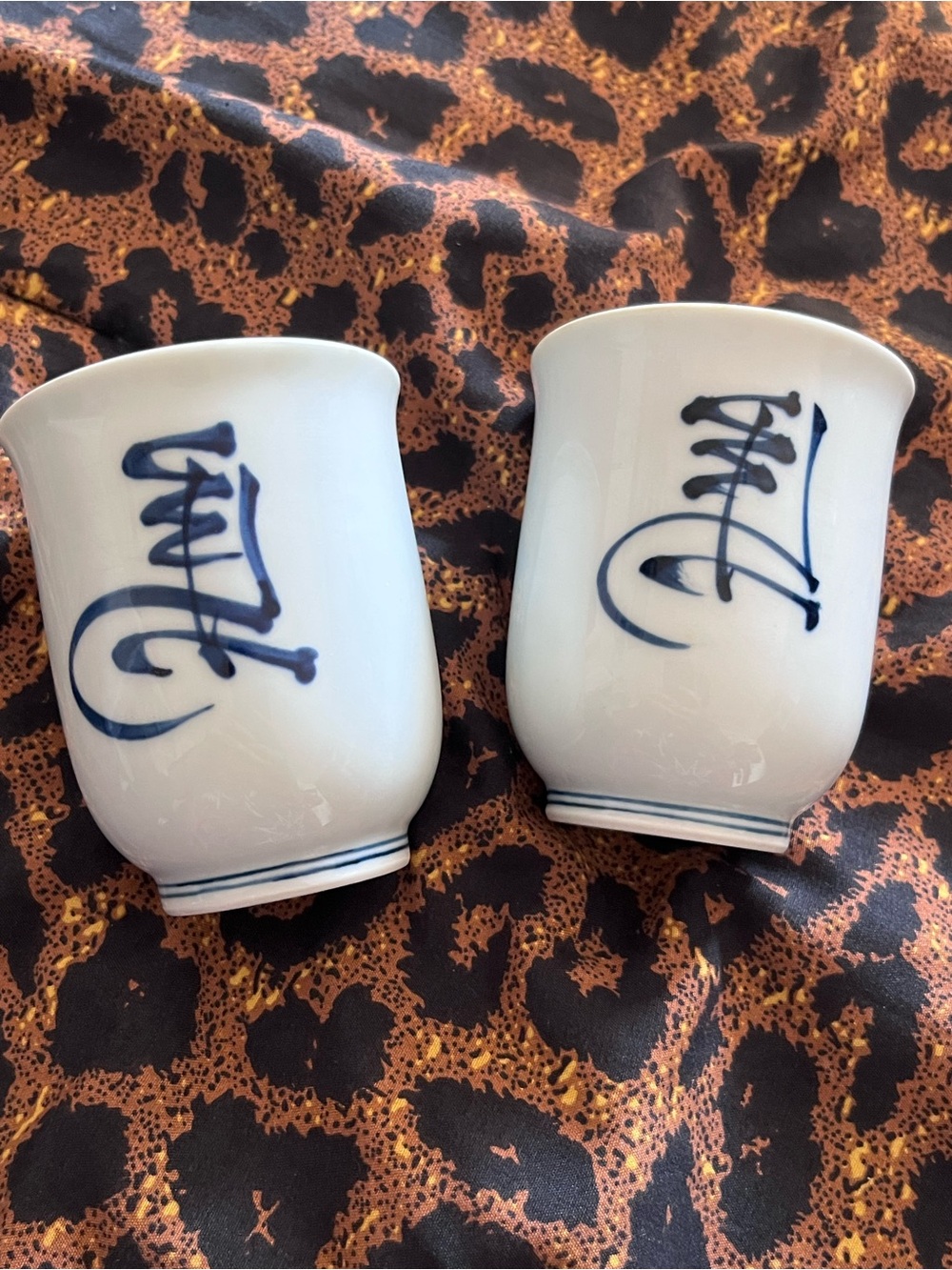 Japanese White Porcelain Blue Script Tea Cups - Set of 2